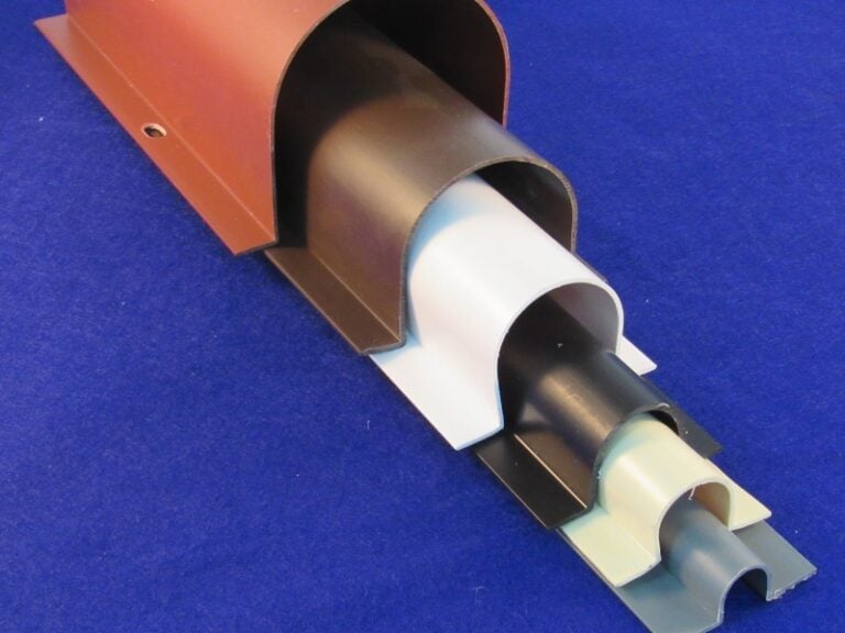 Wire guards designed to protect cabling stacked on top of each other in various sizes and colors.